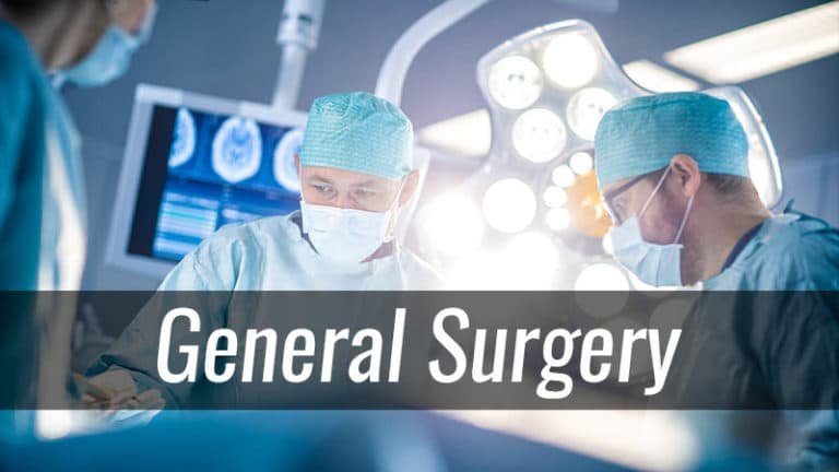 General surgery team performing a surgical procedure in a modern operating room with medical monitors and surgical lighting.