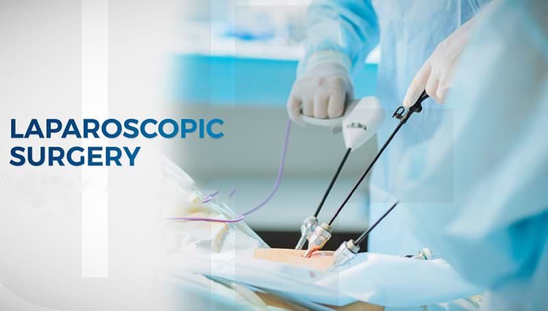 Surgeon performing laparoscopic surgery using minimally invasive surgical instruments.