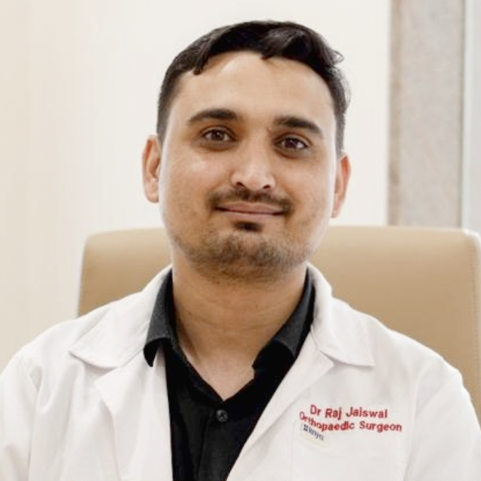 Portrait of Dr. Raj Jaiswal, MS Orthopaedics, wearing a white medical coat at Anantshree Multispeciality Hospital, Bhopal.
