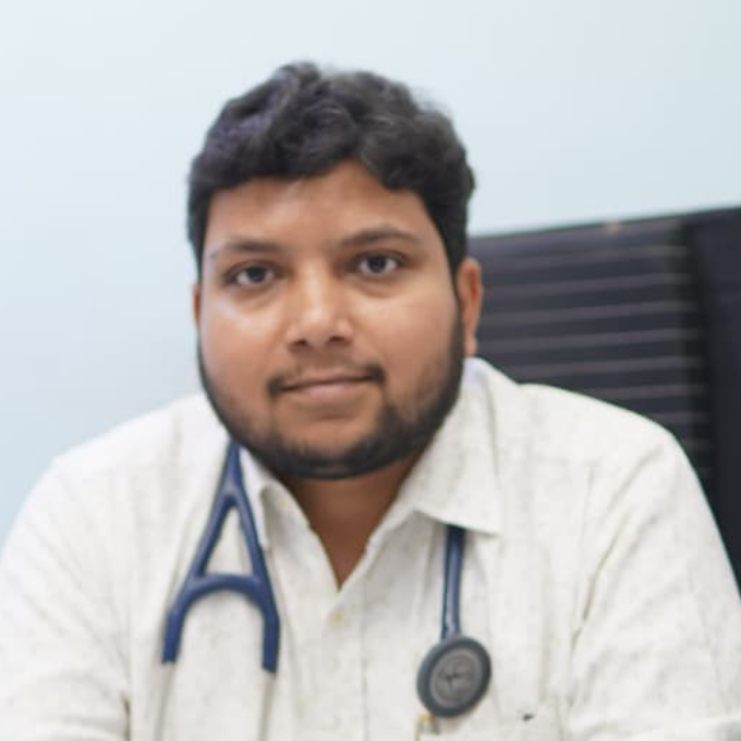 Portrait of a male doctor wearing a white medical coat and stethoscope, associated with Anantshree Multispeciality Hospital, Bhopal.