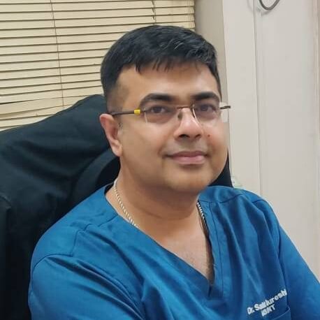 Portrait of Dr. Sadat Qureshi, MS ENT, wearing medical scrubs at Anantshree Multispeciality Hospital, Bhopal.